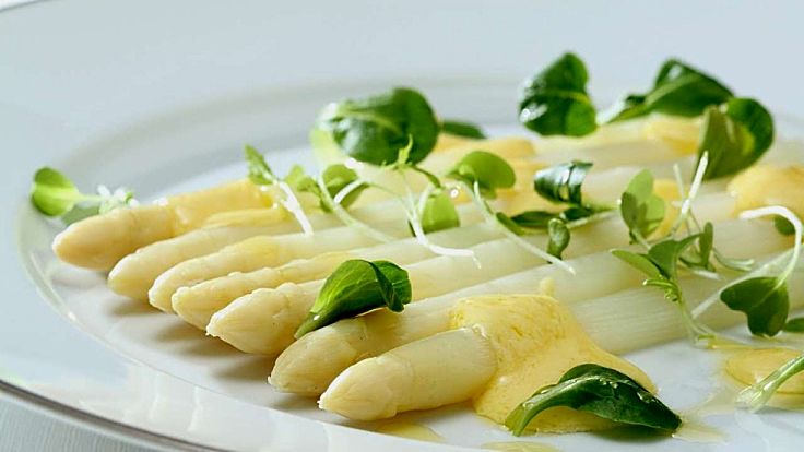 Steamed White asparagus with a lovely white sauce and herbs