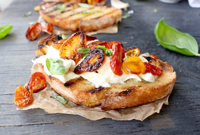 Top toasted bruschetta with cheese and herbs - see the wonderful and tasty range of variations in this article
