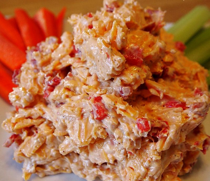 The texture of the pimento cheese can be adjusted by grating the cheese coarsely or finely, how finely the pimento is chopped and by using a food processor.