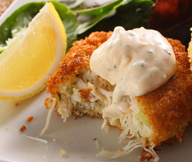 A spicy white sauce with fresh herbs is a great addition for homemade crab cakes