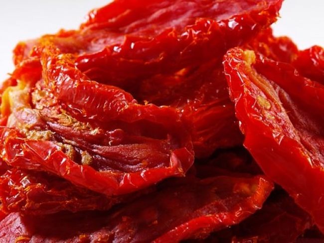 Homemade dried tomatoes are delicious and can be done by slow roasting in a conventional over on a low heat setting with the door slightly ajar.