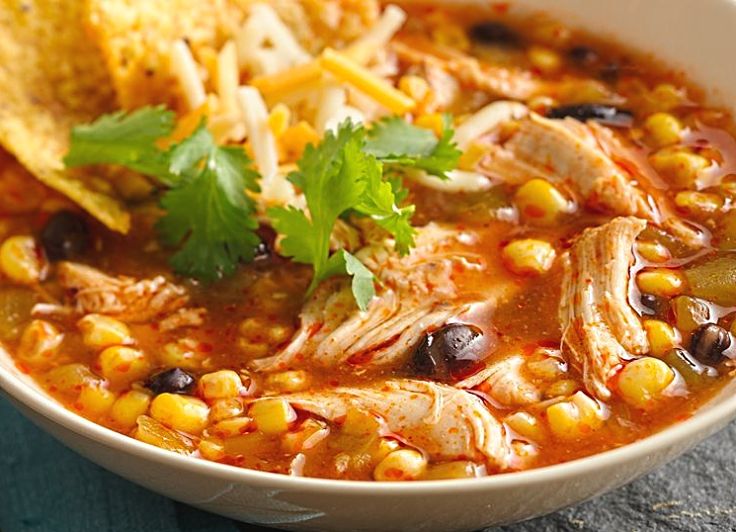 Chicken Enchilada Soup is a delight when slow cooked in a stock pot. This blends the flavors and ensures the beans are soft and the chicken tender and stringy.