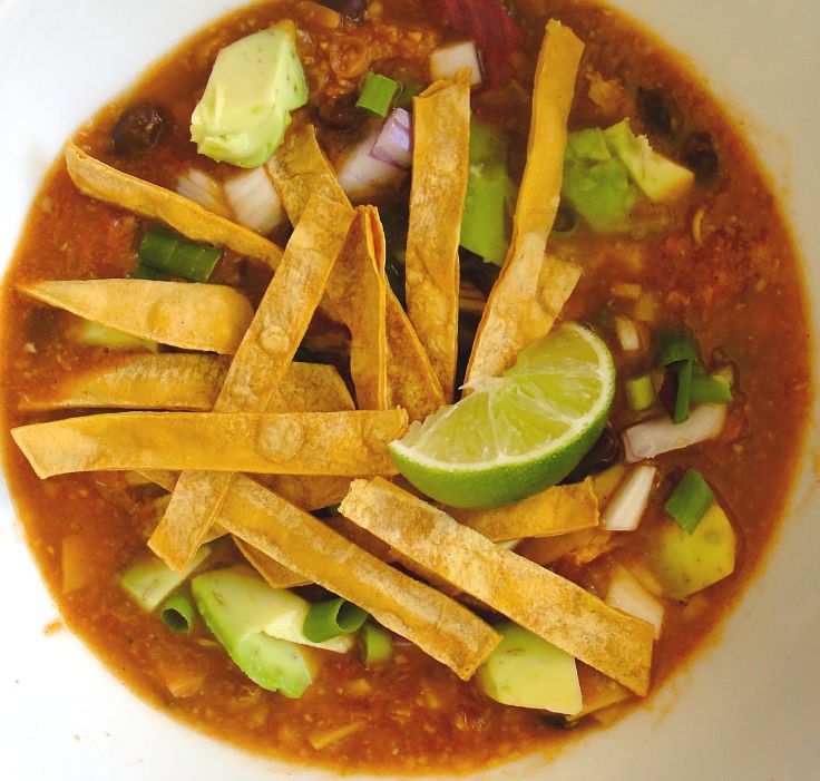 Lime, avocado, spring onion and fried tortilla strips add to the appeal of a genuine tortilla soup. Enjoy!