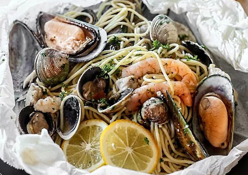 Delightful combination of fresh seafood cooked to perfection in parchment