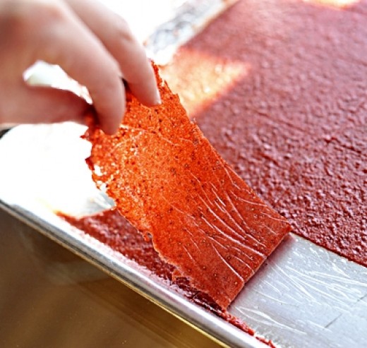 The strips are cut and pulled away from the paper and pan ready for rolling