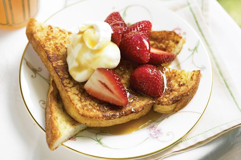 Dipping the bread for French toast. Don't rush the dipping, but allow time for the mixture to infuse into the bread