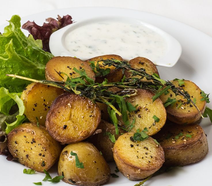 Roast potatoes with herbs and spices make the perfect side dish for many meals including barbecues