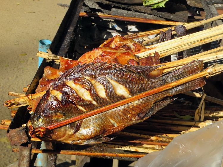 Simply cooked whole fish grilled over an open flame on your barbecue