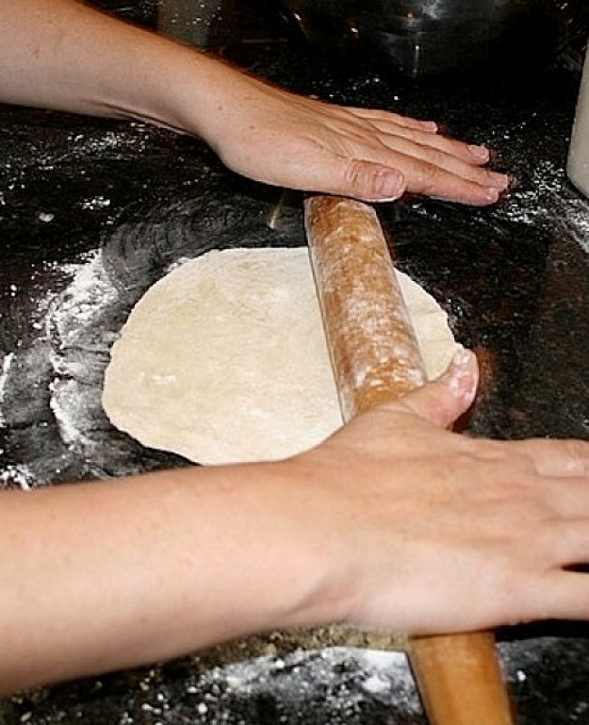 Rolling out the taco mixture very thinly - its child's play