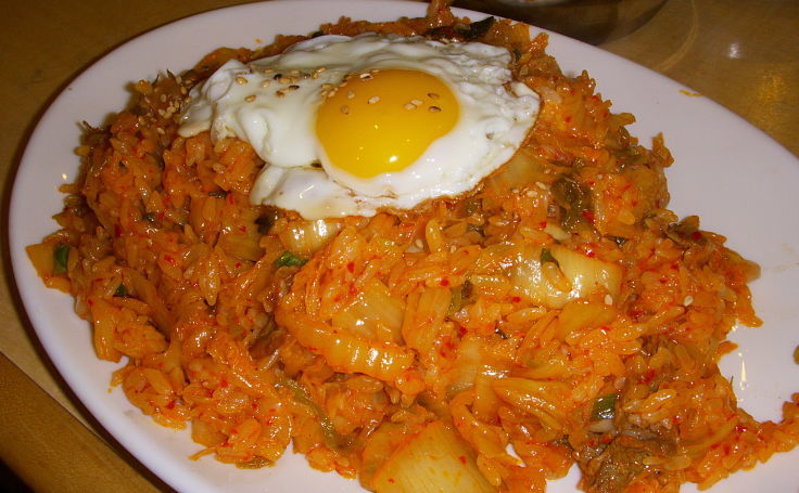 Kimchi fried rice is a traditional Korean snack food that you can make at home using this delightful collection of recipes with many variations