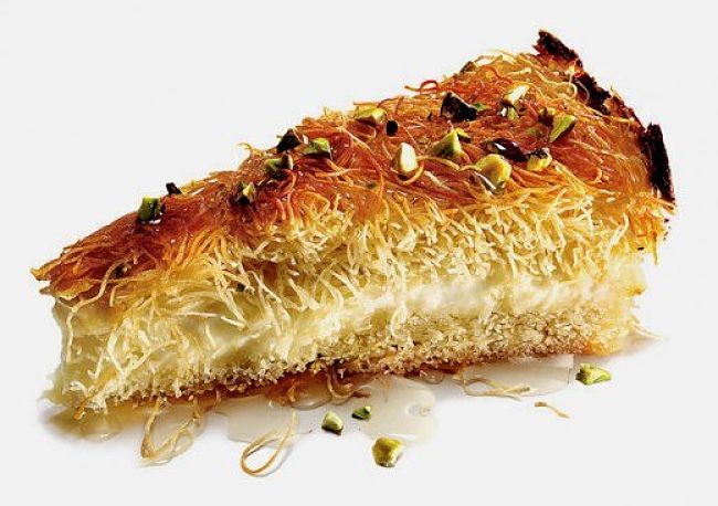 Pecans add a delightful touch to a Knafeh dessert imbibed with a sugar and rosewater syrup