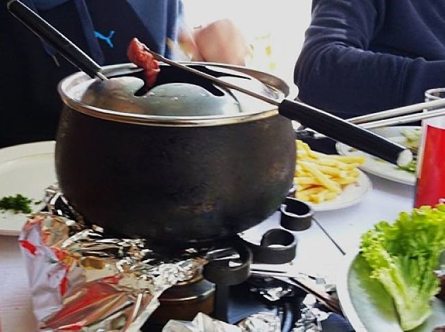 Traditional Fondue cookers can be adapted for cooking Korean barbecues. This one was used by a restaurant in Geneva, Switzerland. My family and I enjoyed the experience