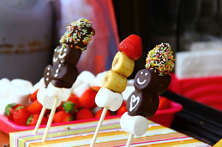 Marshmallows can be used to make delightful party treats using fruit and other treats on wooden sticks
