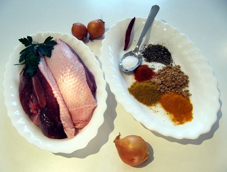 Ingredients for a Classic Duck Mulligatawny soup with small fried onions added to the soup before serving.
