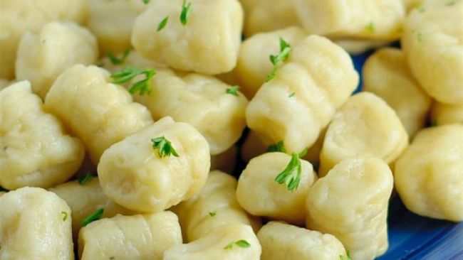 Delightful gnocchi just cooked and ready to serve with a sauce