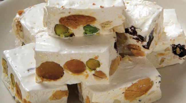 Cheeries and saltana add to the taste and texture of nuts in this torrone recipe - See more recipes here