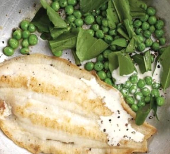 Fish fillet with peas, sorrel and a light white sauce. What a delightful combination