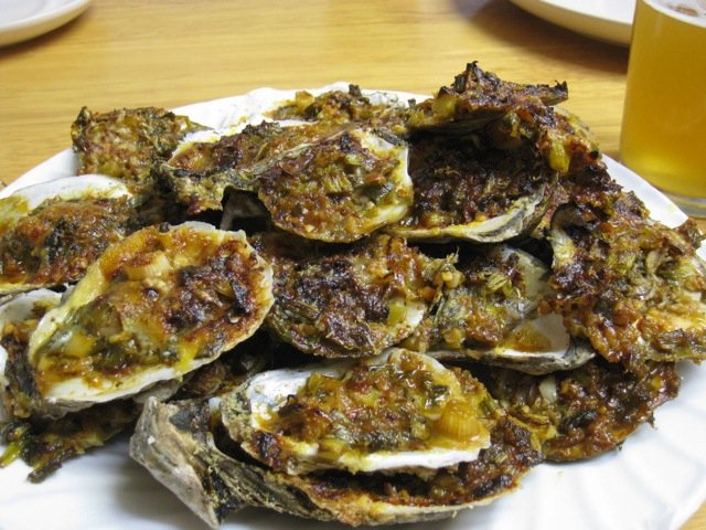 Grilled oysters topped with cheese and herbs is the perfect combination. See two great recipes here