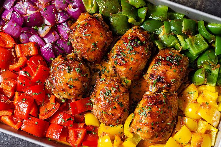 Delicious spicy chicken, bell pepper and vegetable pan sheet supper with herbs and spices