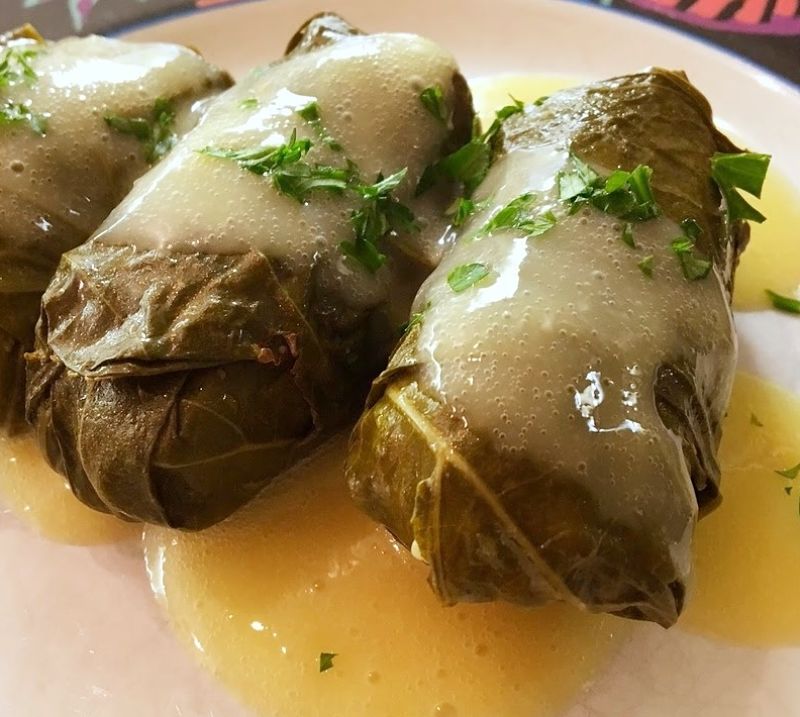 A spicy sauce and a sprinkling of herbs add to the interest and intrigue of stuffed grape leaves.