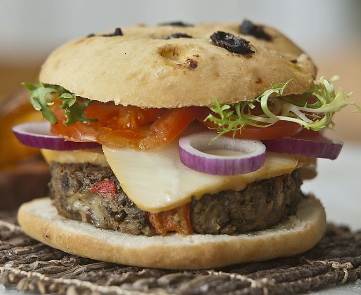 Vegan cheese is a great addition for this veggie burger with fresh salad