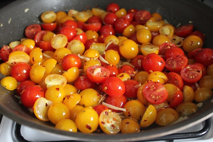 Cooking tom thumb tomatoes is easy after slicing them in half. Cook with onions herbs and chillies